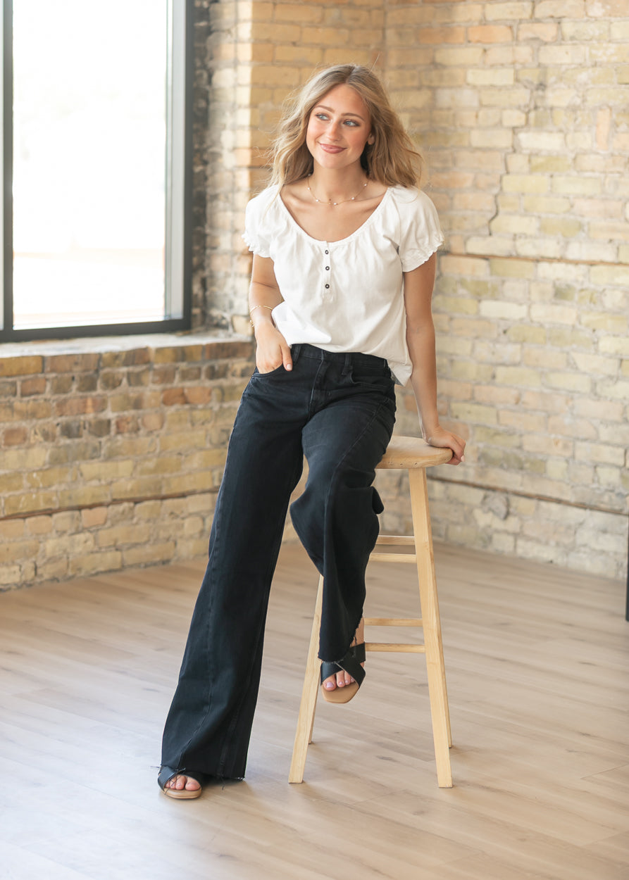 Free People Alter Ego boyfriend jeans in black wash styled with an ivory blouse and sandals