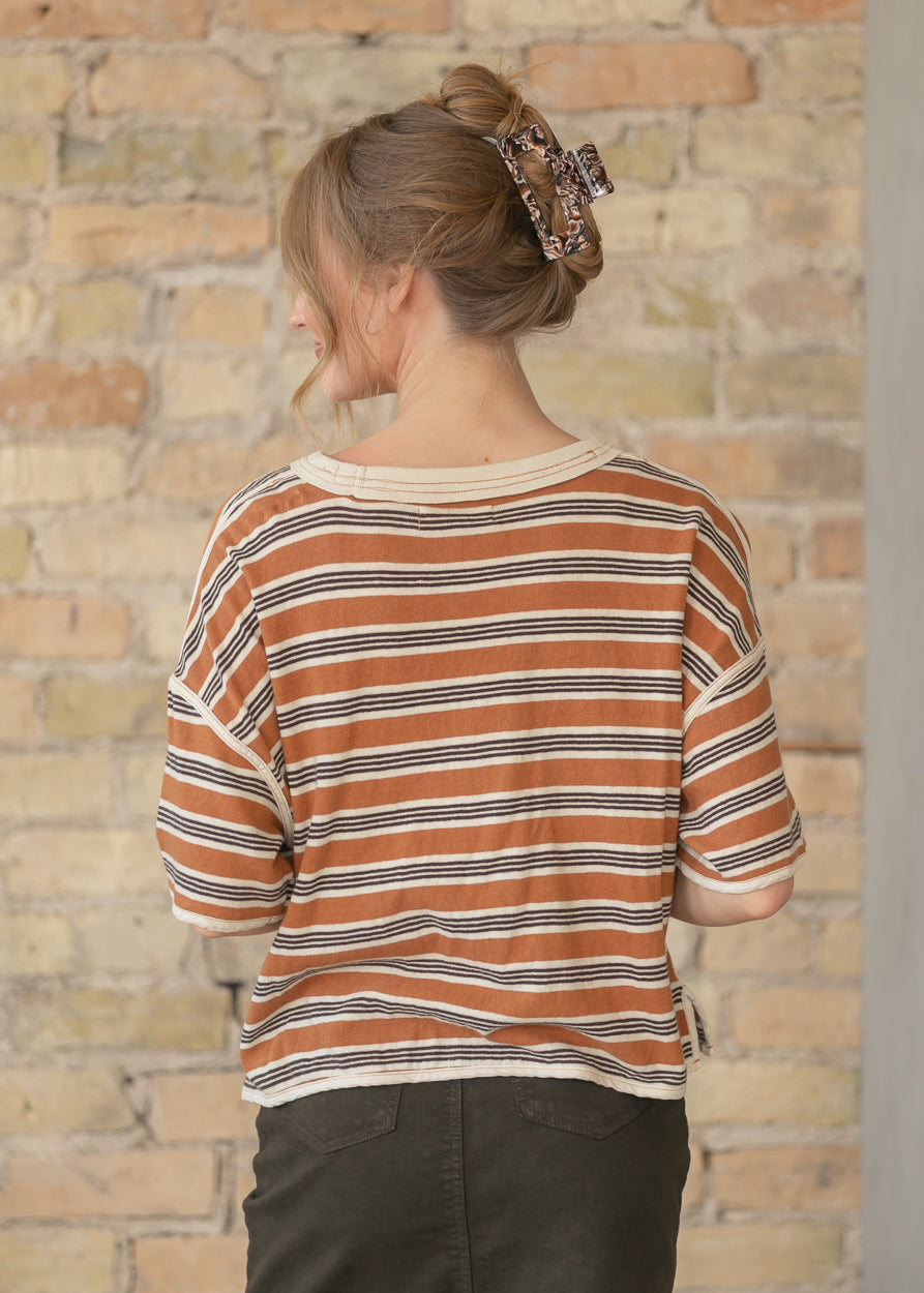 Back view of striped oversized tee with exposed seam details
