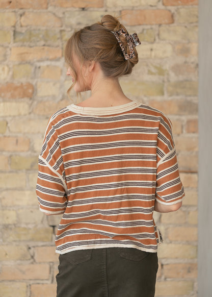 Back view of striped oversized tee with exposed seam details