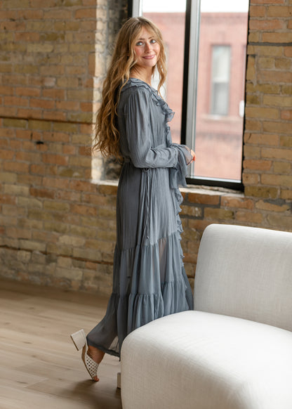 Free People Isla midi dress with cascading ruffles, flared cuffs, tie waist, and flowing midi-length skirt.