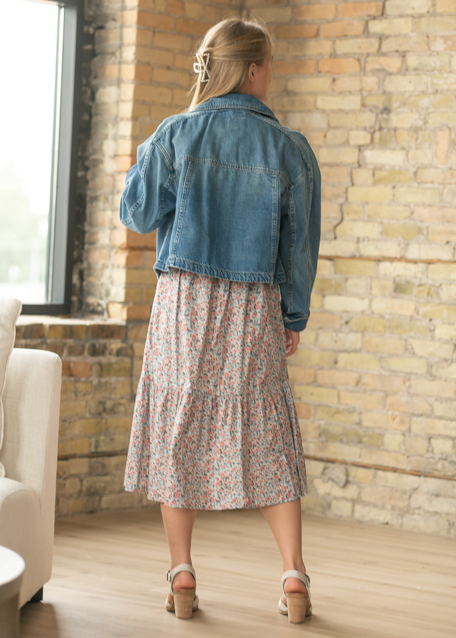 Back view of Free People denim jacket with relaxed fit and cropped silhouette