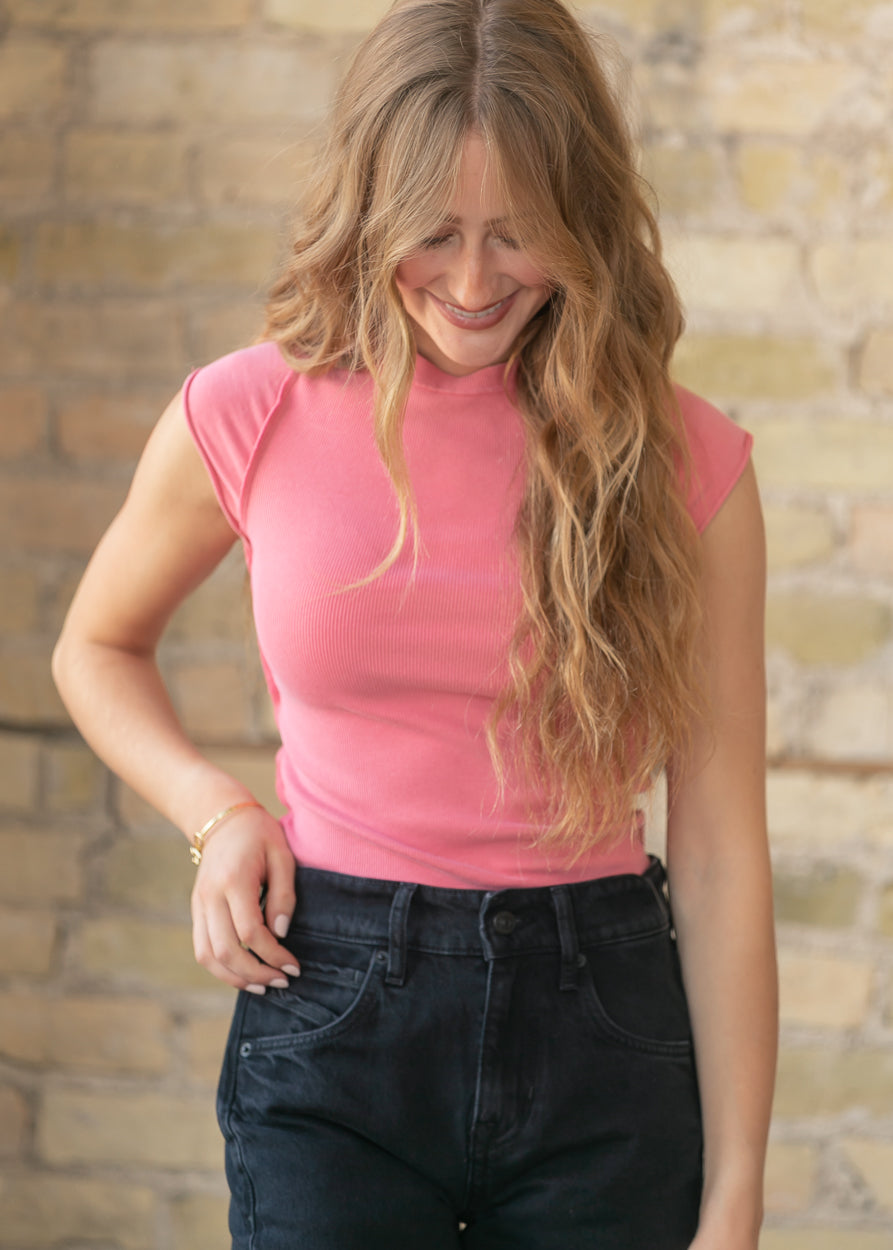Fitted strawberry pink knit tee styled with black wide leg denim jeans