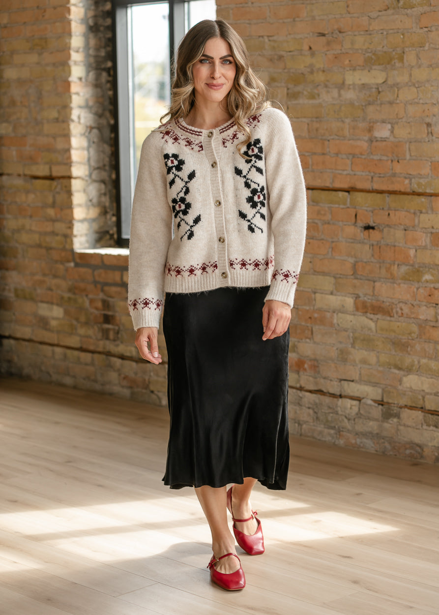 Geometric floral button-up cardigan with loose fit, long sleeves, and ivory knit base.