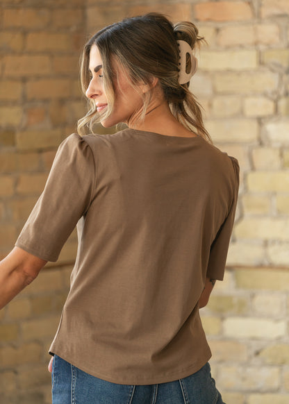 Back of brown Grace shirt showing gathered shoulders and loose hip-length fit.
