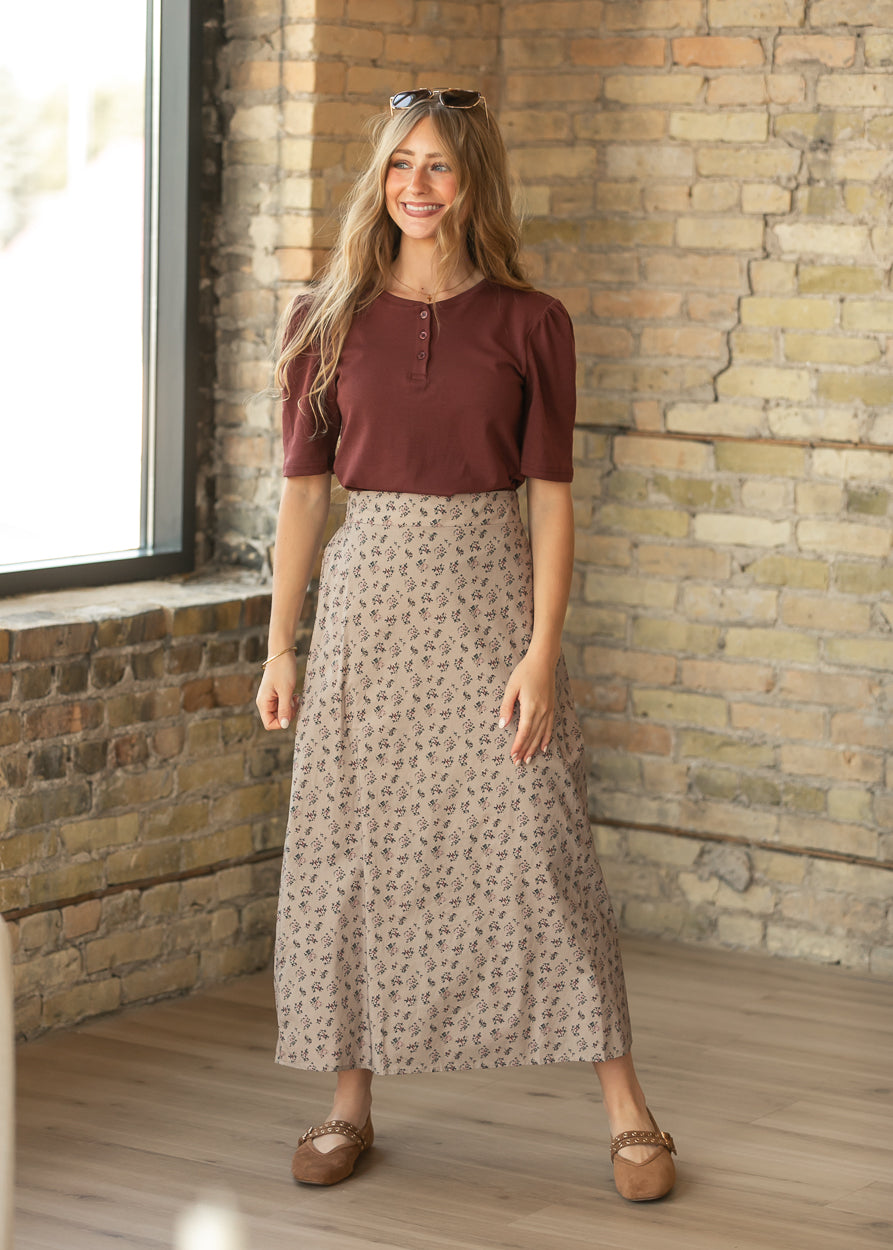 Burgundy cotton button top tucked into a taupe floral maxi skirt for an easy everyday outfit.
