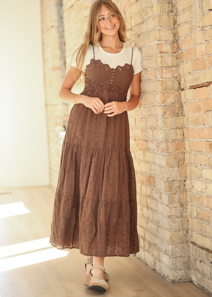 Front view of cocoa tiered eyelet maxi dress layered over a cream ribbed tee.