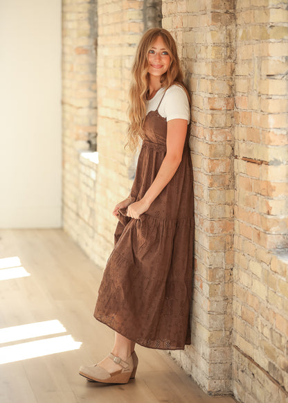 Side view of cocoa cotton eyelet maxi dress with tiered skirt and feminine scalloped details.