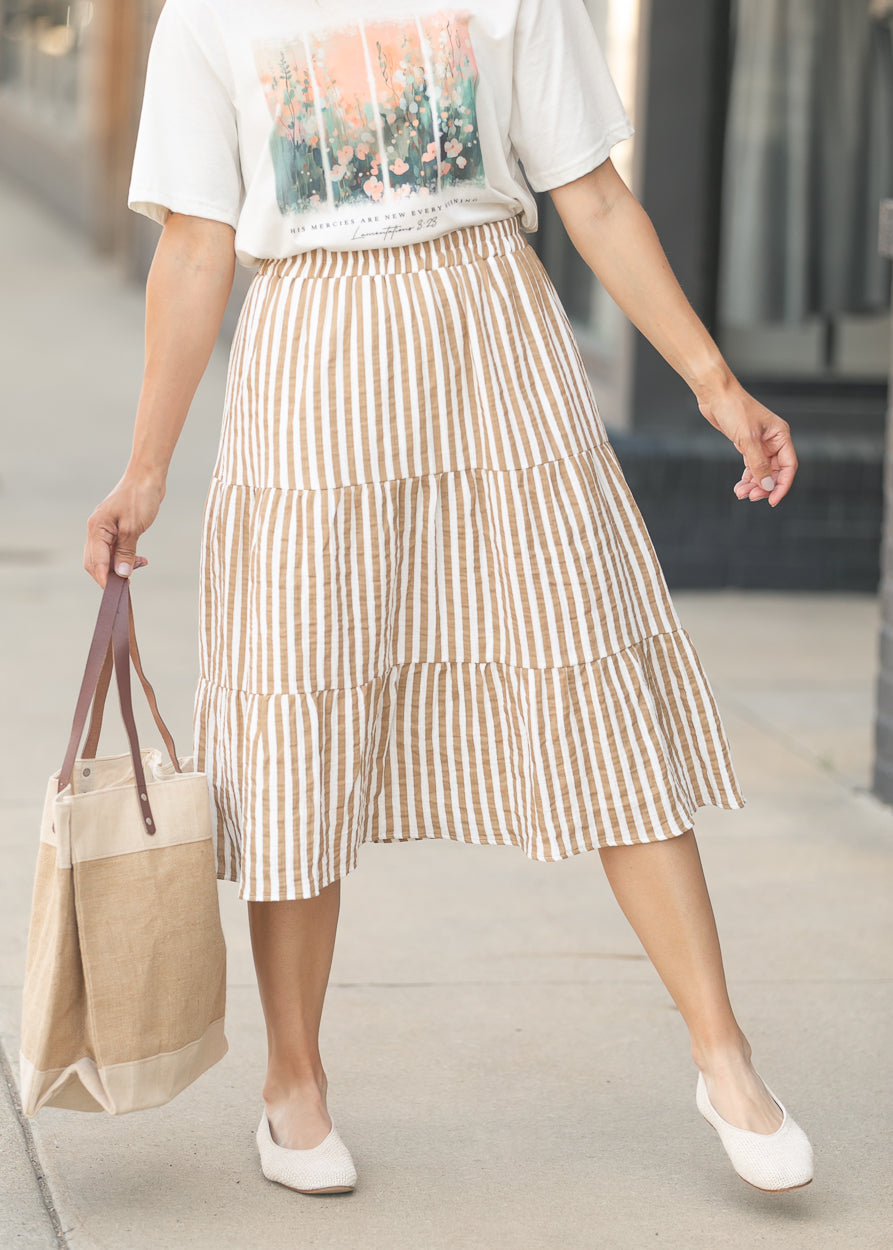 Neutral striped midi skirt with feminine movement and texture