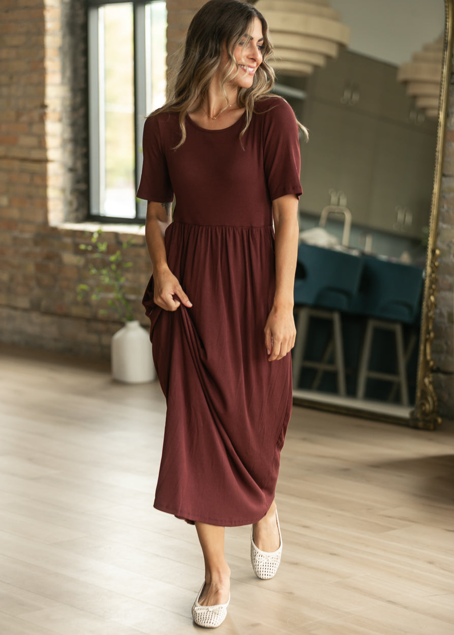 Cranberry Jasmine ribbed maxi dress with short sleeves, gathered waist, and flowing skirt.