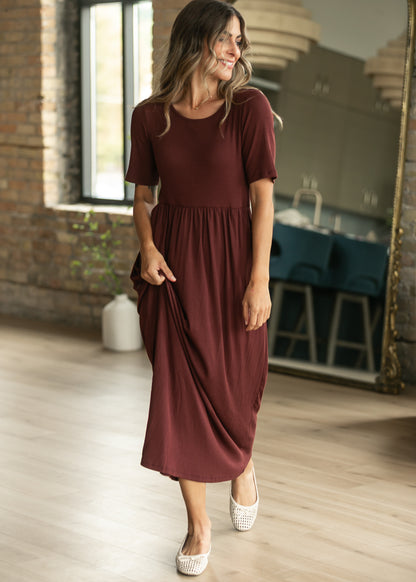 Cranberry Jasmine ribbed maxi dress with short sleeves, gathered waist, and flowing skirt.