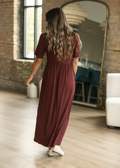 Back of cranberry ribbed maxi dress showing the simple short sleeve silhouette.