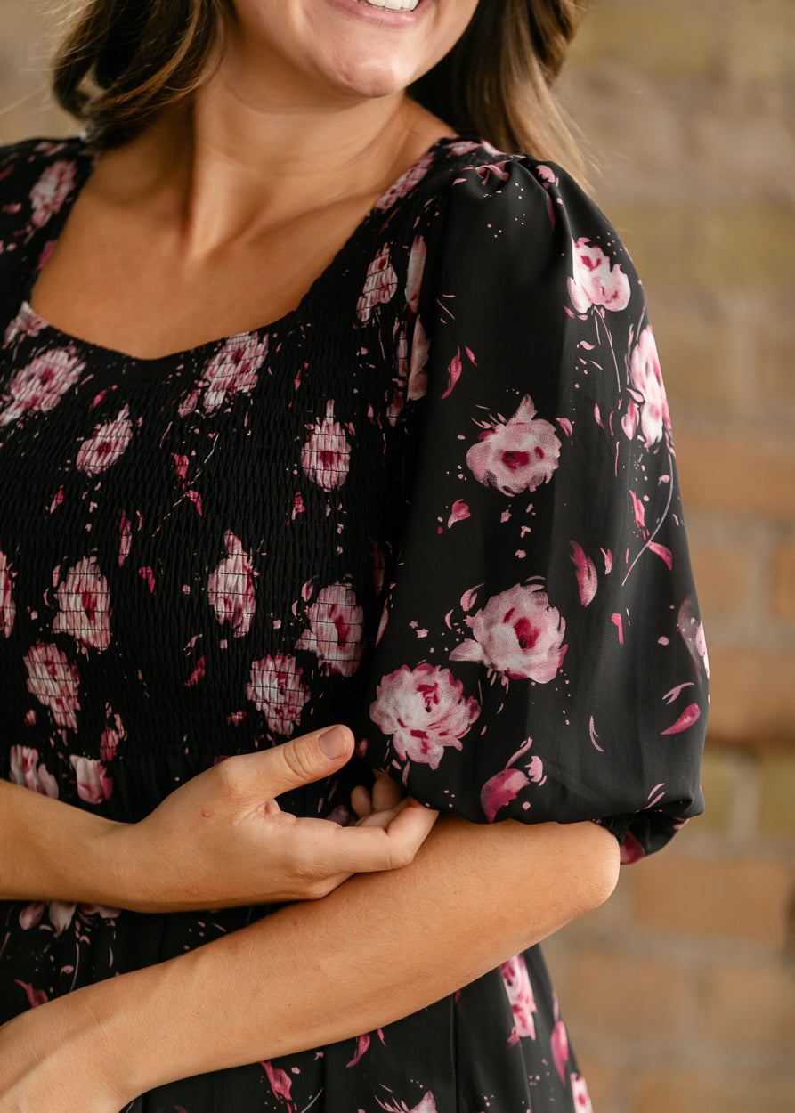 Close-up of Kayleen floral dress showing the smocked bodice, square neckline, and puff sleeve detail.