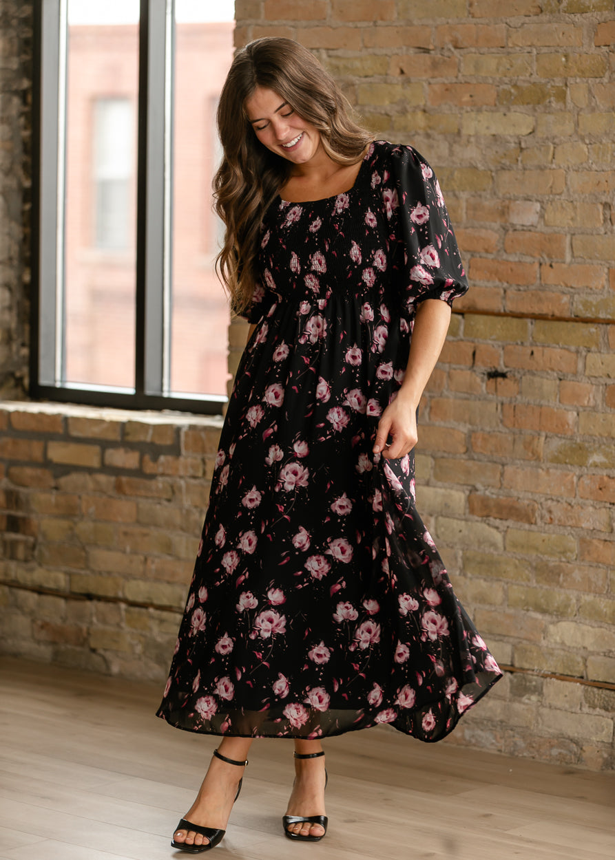 Kayleen floral maxi dress shown from the front with smocked bodice and black ankle-strap heels.