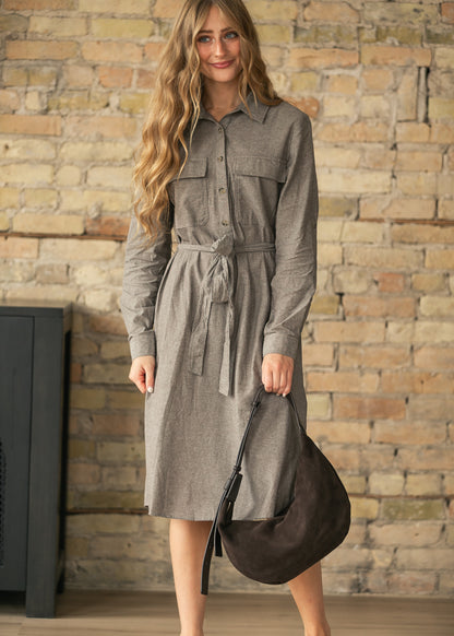 Kimberly brown shirt dress showing its semi-fitted midi silhouette and belted waist.