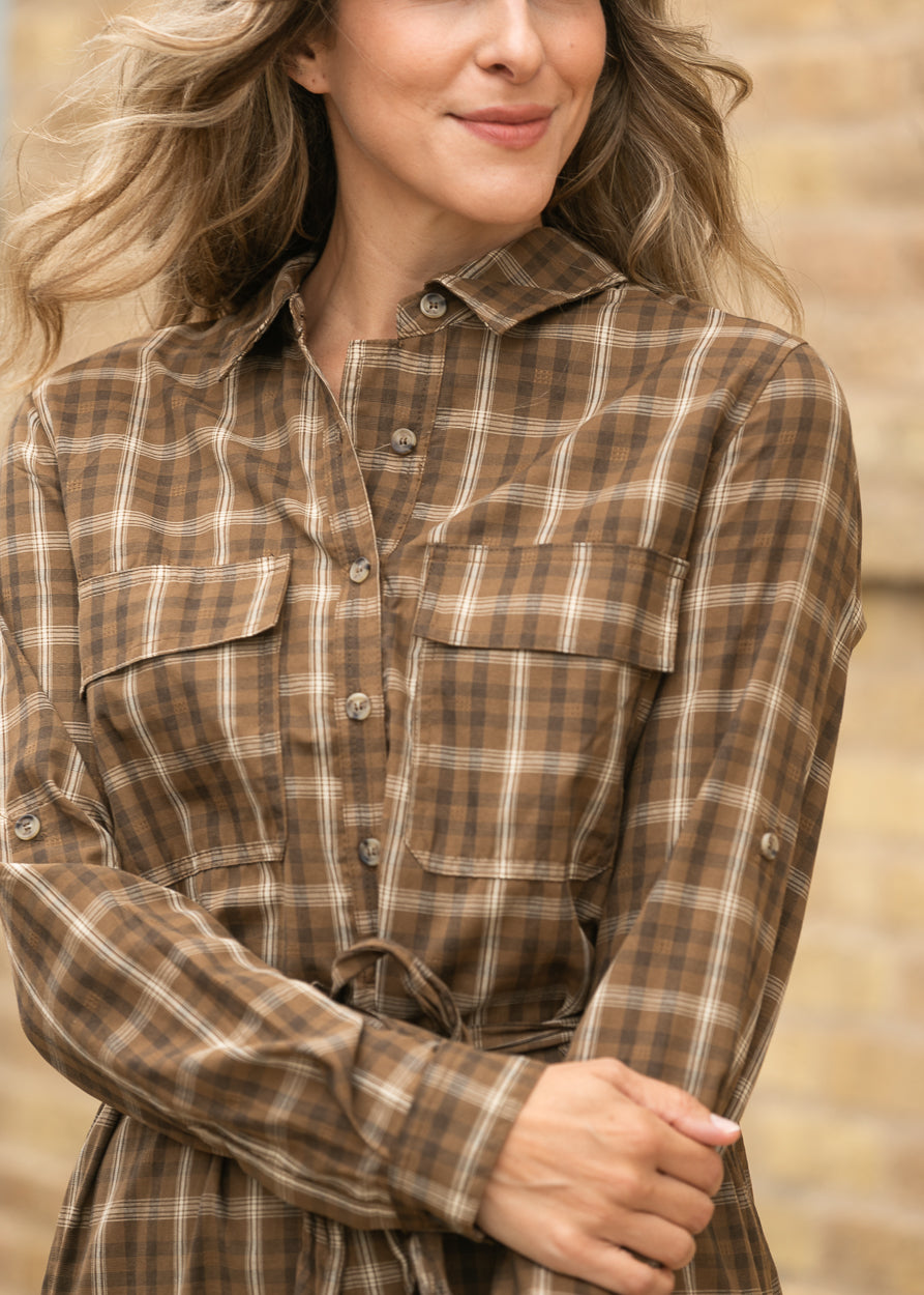 Close-up of Kimberly brown plaid dress showing the neckline, buttons, and cotton plaid pattern.