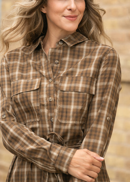 Close-up of Kimberly brown plaid dress showing the neckline, buttons, and cotton plaid pattern.