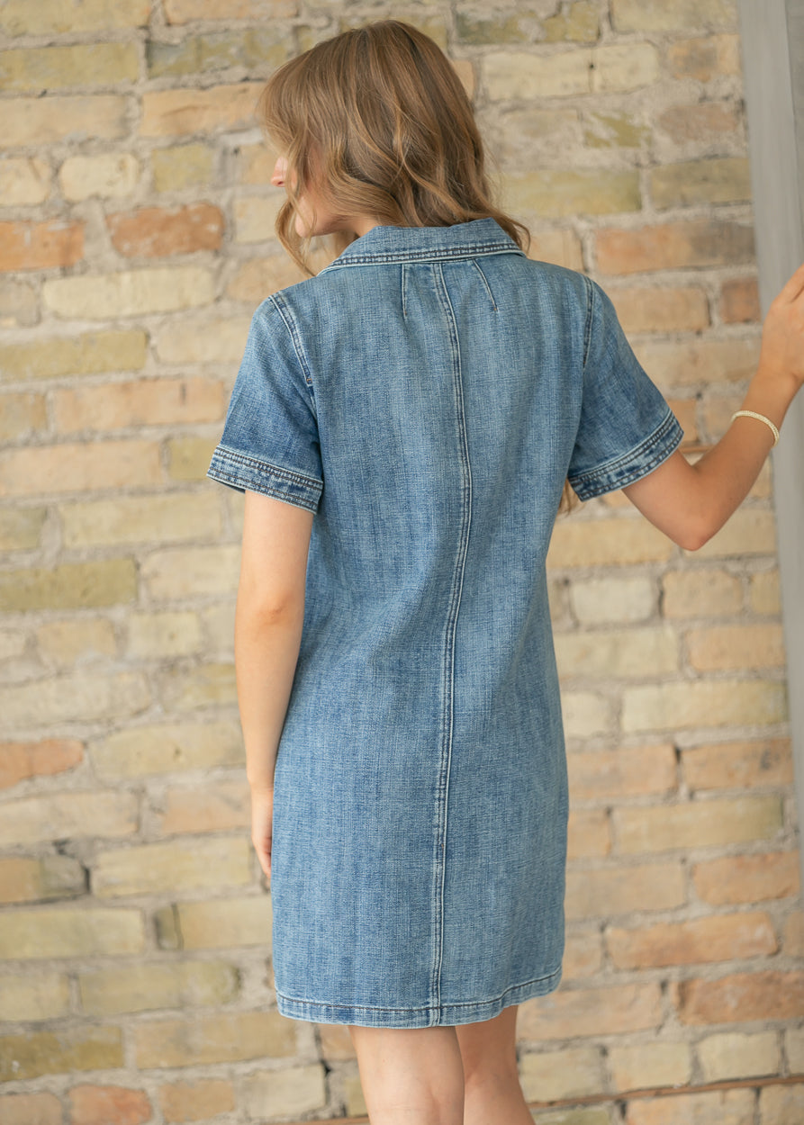 Back view of medium wash denim midi dress with short sleeves.
