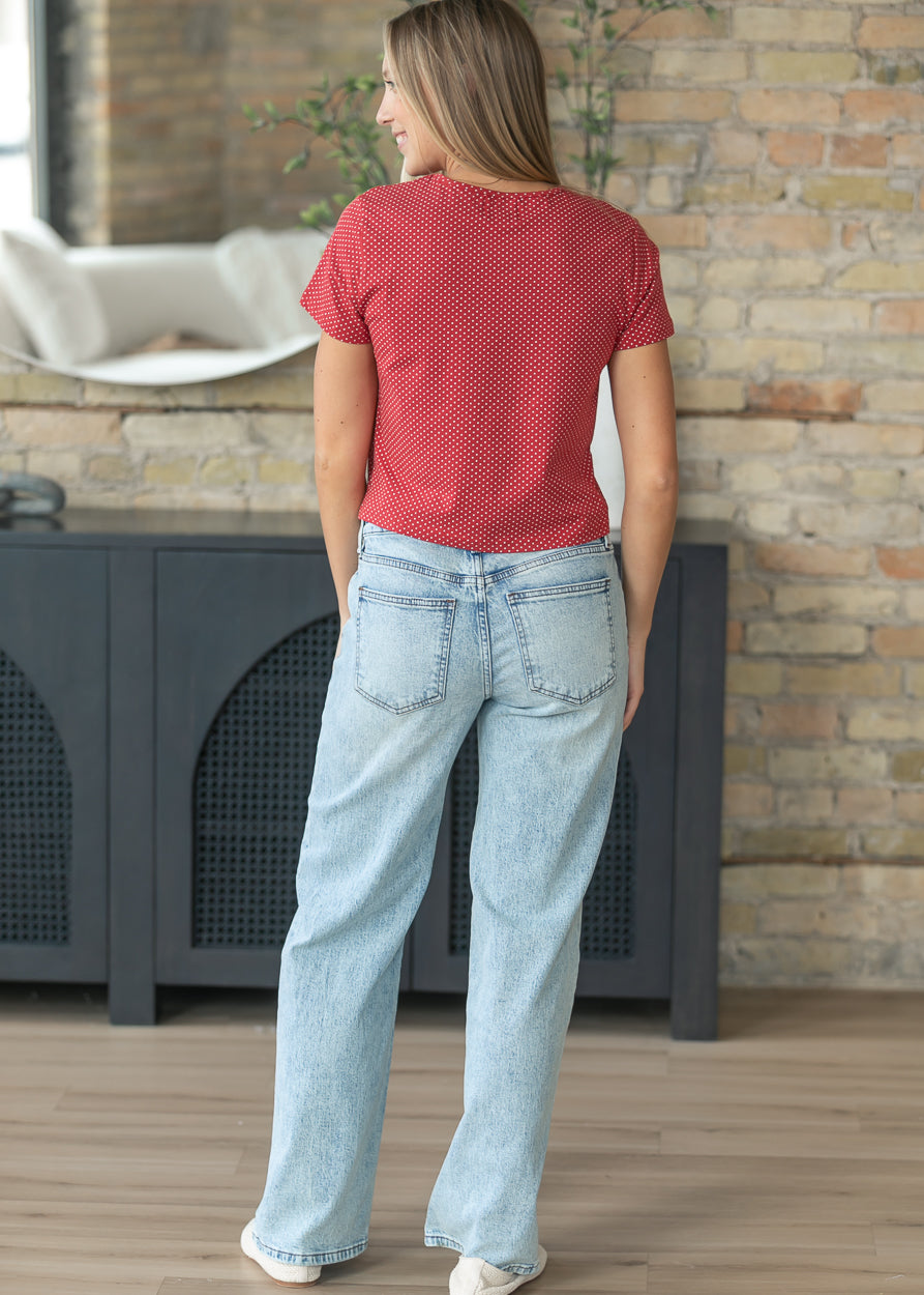 Back view of light wash Selena baggy straight leg jeans with classic back pockets.