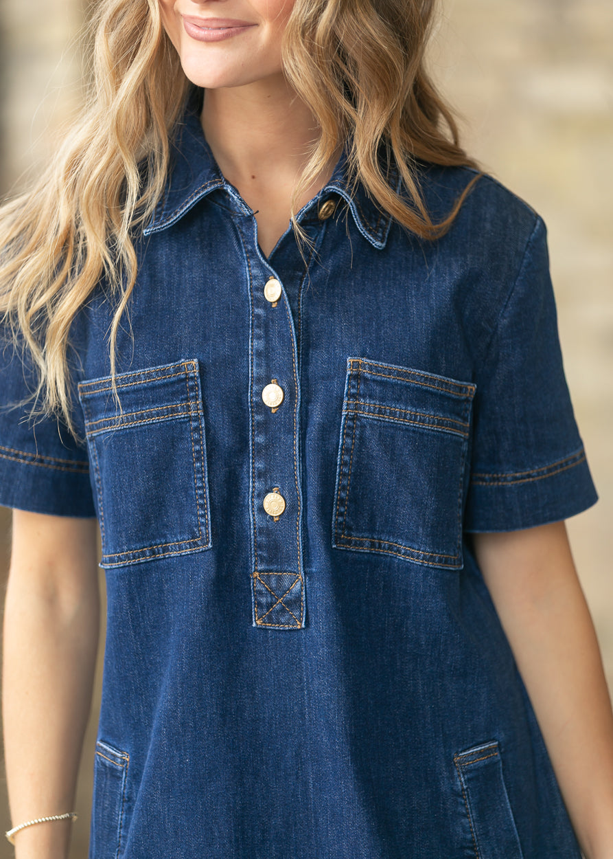 Close-up of the Tatiana denim dress collar, button placket, and front patch pockets.