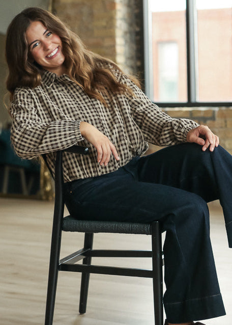 Amaze dark wash wide-leg jeans styled with brown flats and a gingham blouse