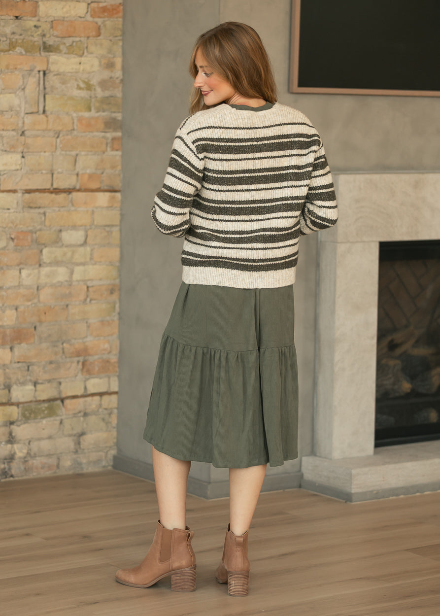 Cream and green striped cardigan shown from the back with long sleeves and a relaxed layering fit.