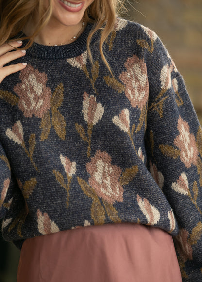 Navy floral long sleeve sweater with dusty rose and cream flowers, close-up of knit texture and ribbed crew neck.