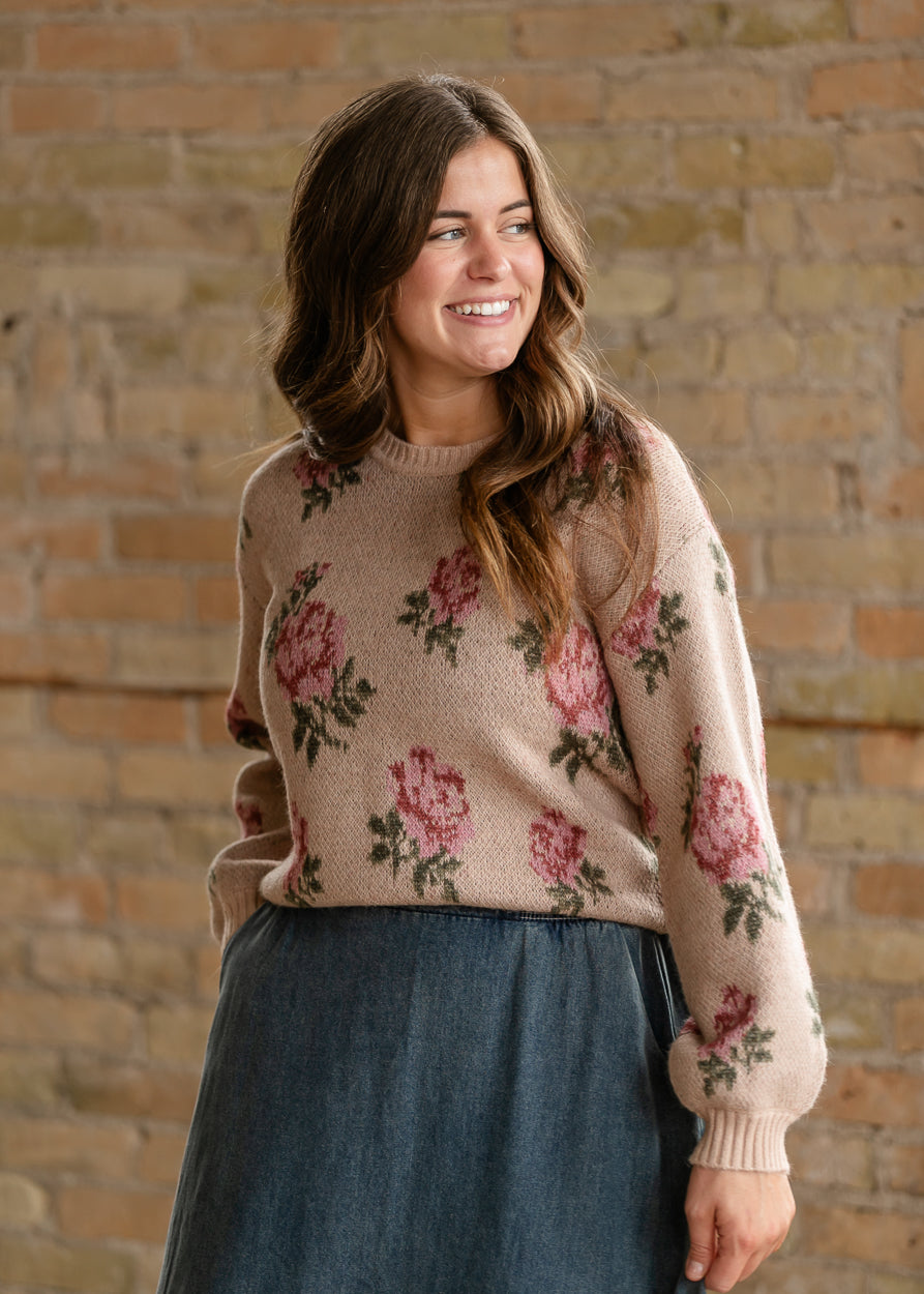 Medium wash denim midi skirt styled with a sand floral sweater and beige loafers.