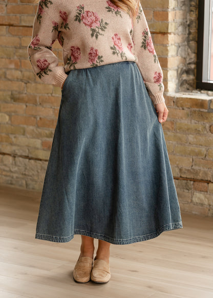 Medium wash A-line denim midi skirt with 35-38 inch length and lightweight drape.