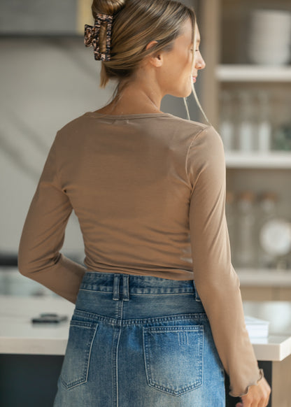 Back of the brown ribbed long sleeve top, showing the fitted shoulder seam and clean finish.