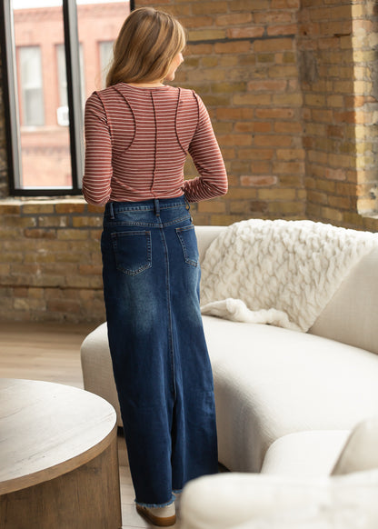 Back view of maroon striped long sleeve top showing curved seam detailing.