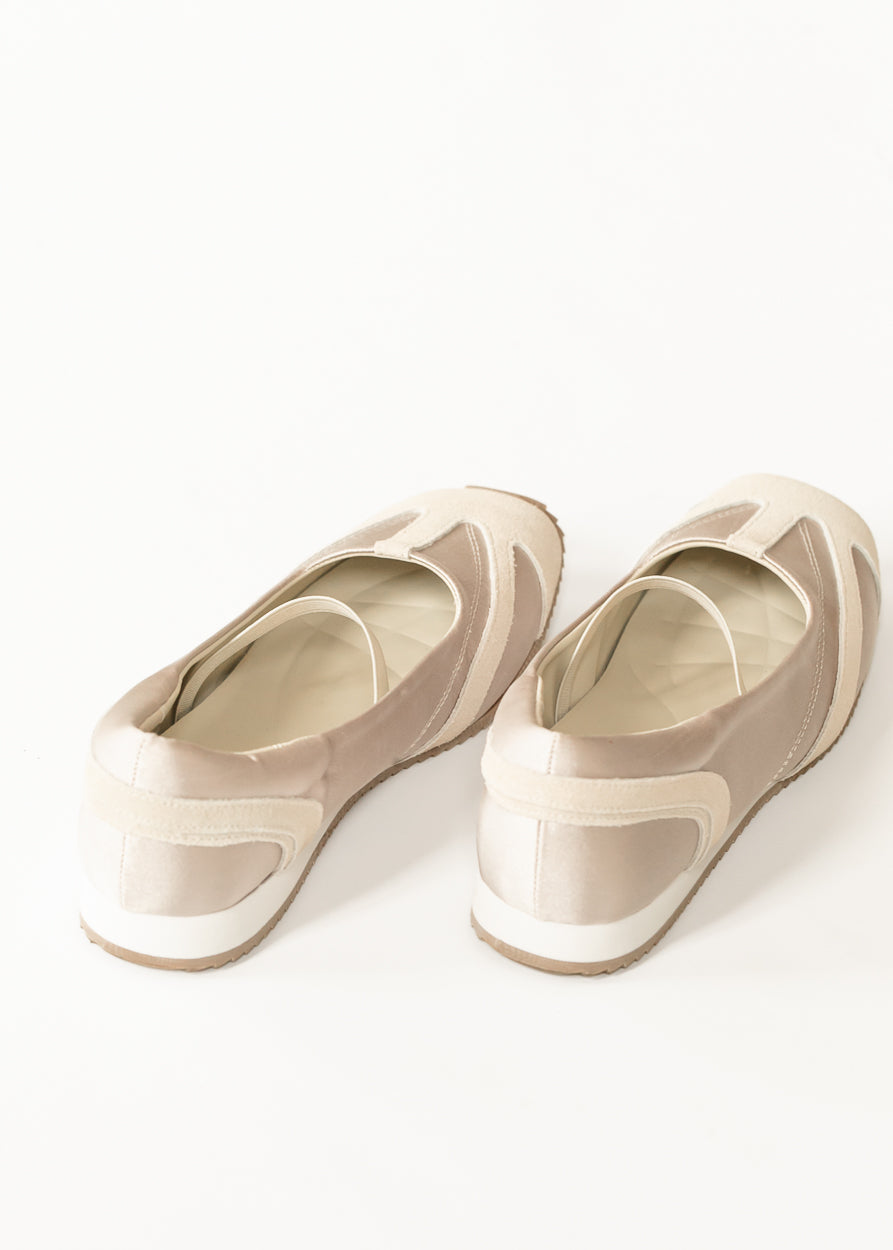 Back of MIA Via Shimmer Flats showing tonal heel panels, low-profile soles, and soft champagne finish.