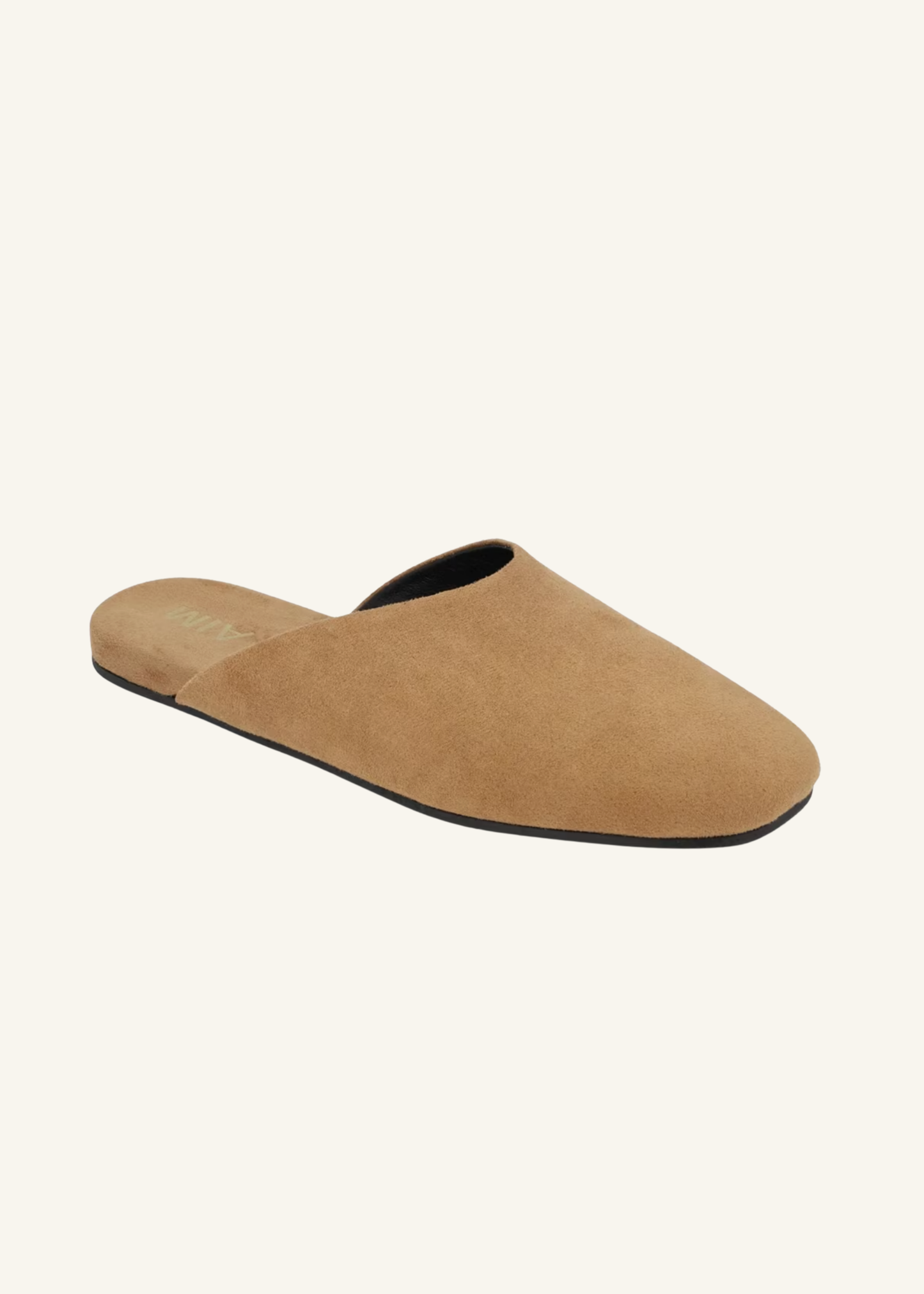 Angled view of MIA Ziva tan slides showing the smooth closed-toe upper and open-back silhouette.