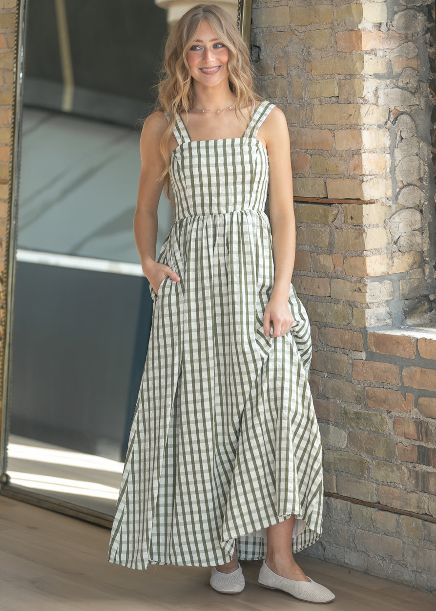 Back of sweet pea gingham maxi dress showing smocked back detail and wide straps.