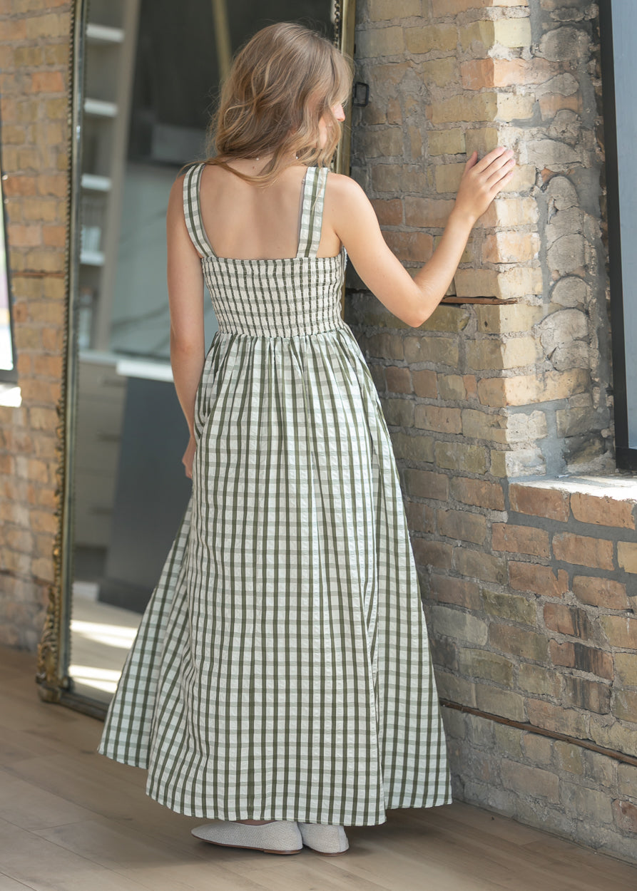 Back of sweet pea gingham maxi dress showing smocked back detail and wide straps.