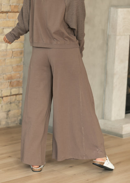 Back of mocha sweatshirt and wide leg pants set showing relaxed fit and textured sleeves.