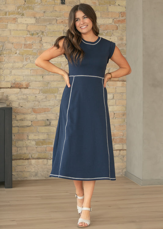 Navy contrast stitch midi dress with cap sleeves and A-line silhouette.