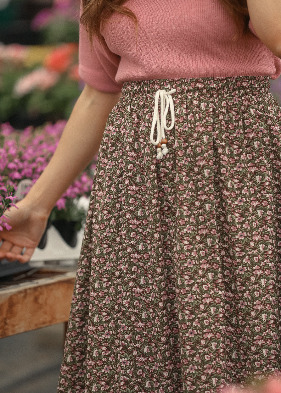 Close up of floral skirt tie waist detail
