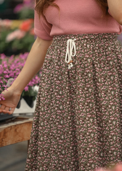 Close up of floral skirt tie waist detail