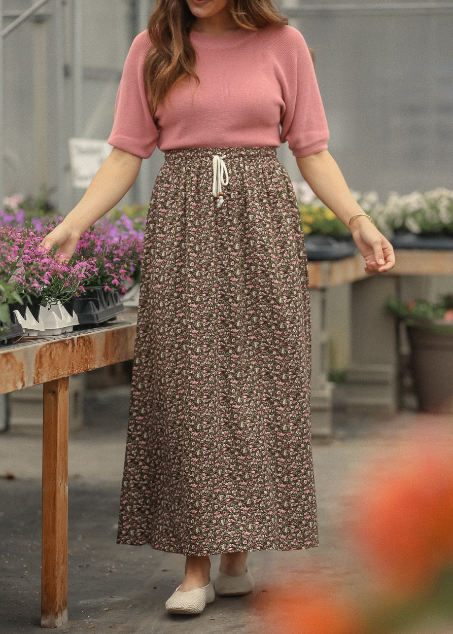 Front view of flowy floral tie front maxi skirt