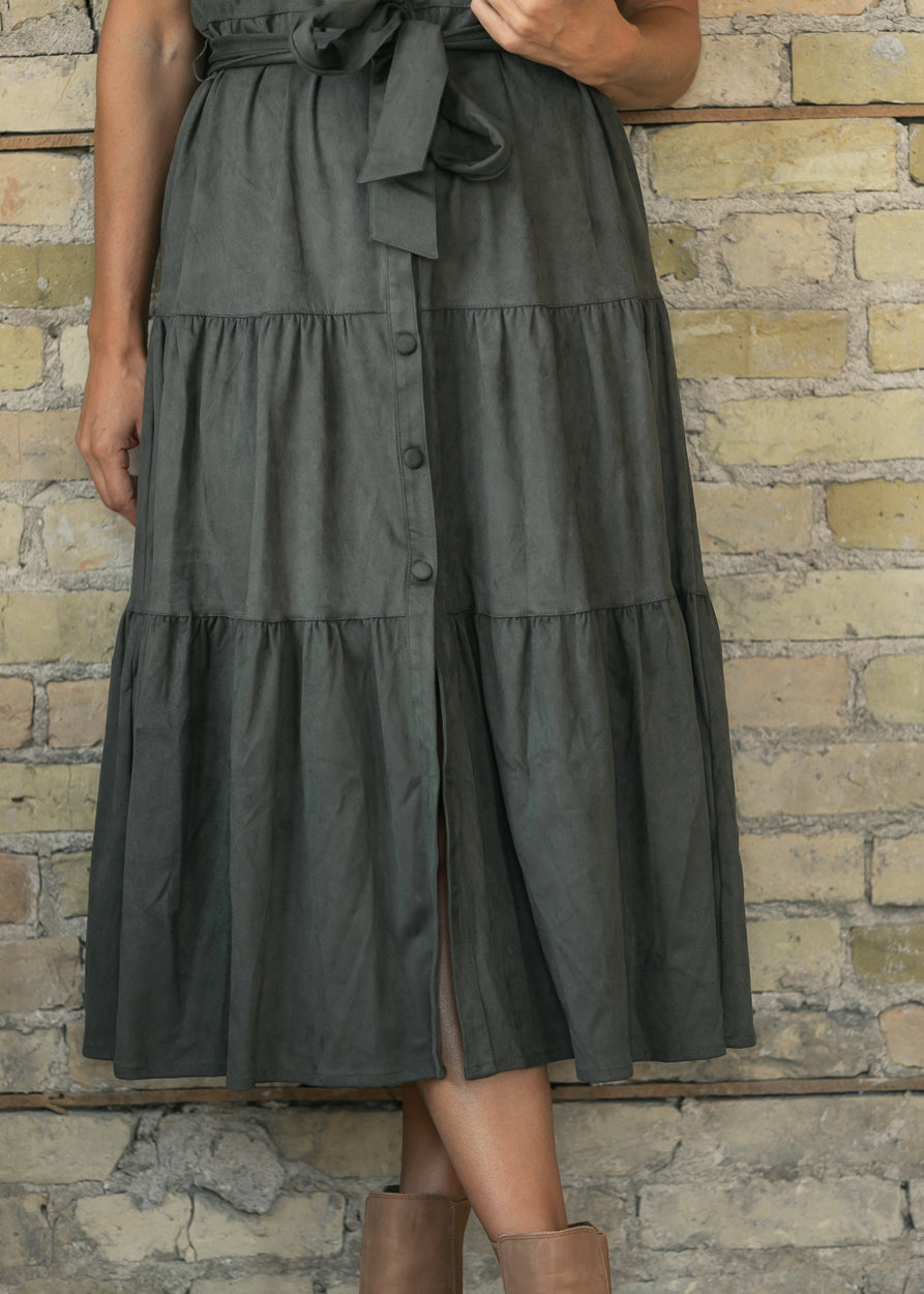 elan olive suede tiered midi dress with button front and tie waist, styled with brown ankle boots.