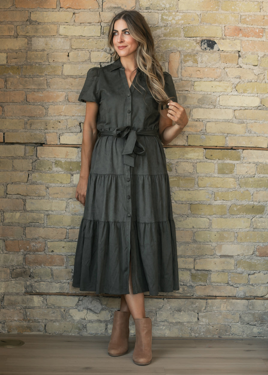 Olive suede midi dress with collared neckline, short sleeves, button front, and self-tie waist.