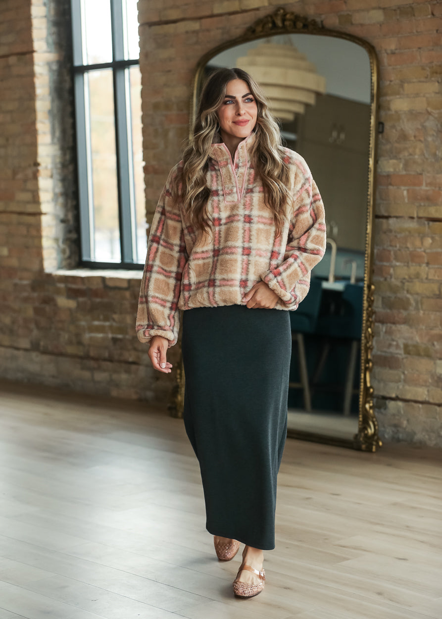 Front view of plaid sherpa fleece pullover with pink trim and cozy sherpa texture