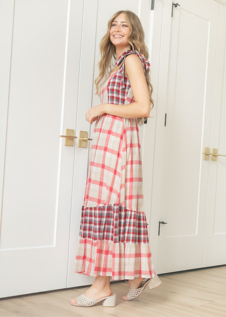 Side view of plaid tie-shoulder maxi dress showing the tiered skirt and contrast plaid hem