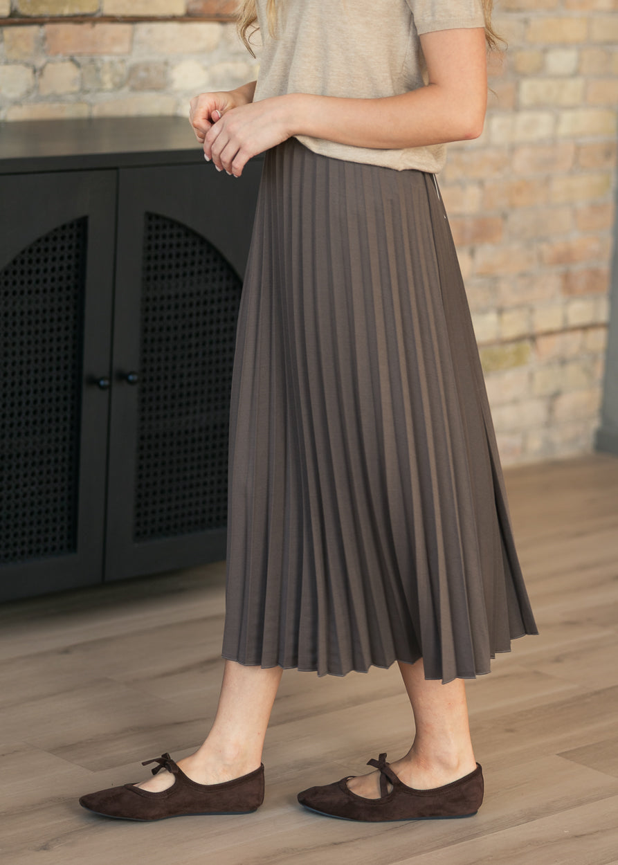 Cocoa pleated midi skirt lifestyle shot.