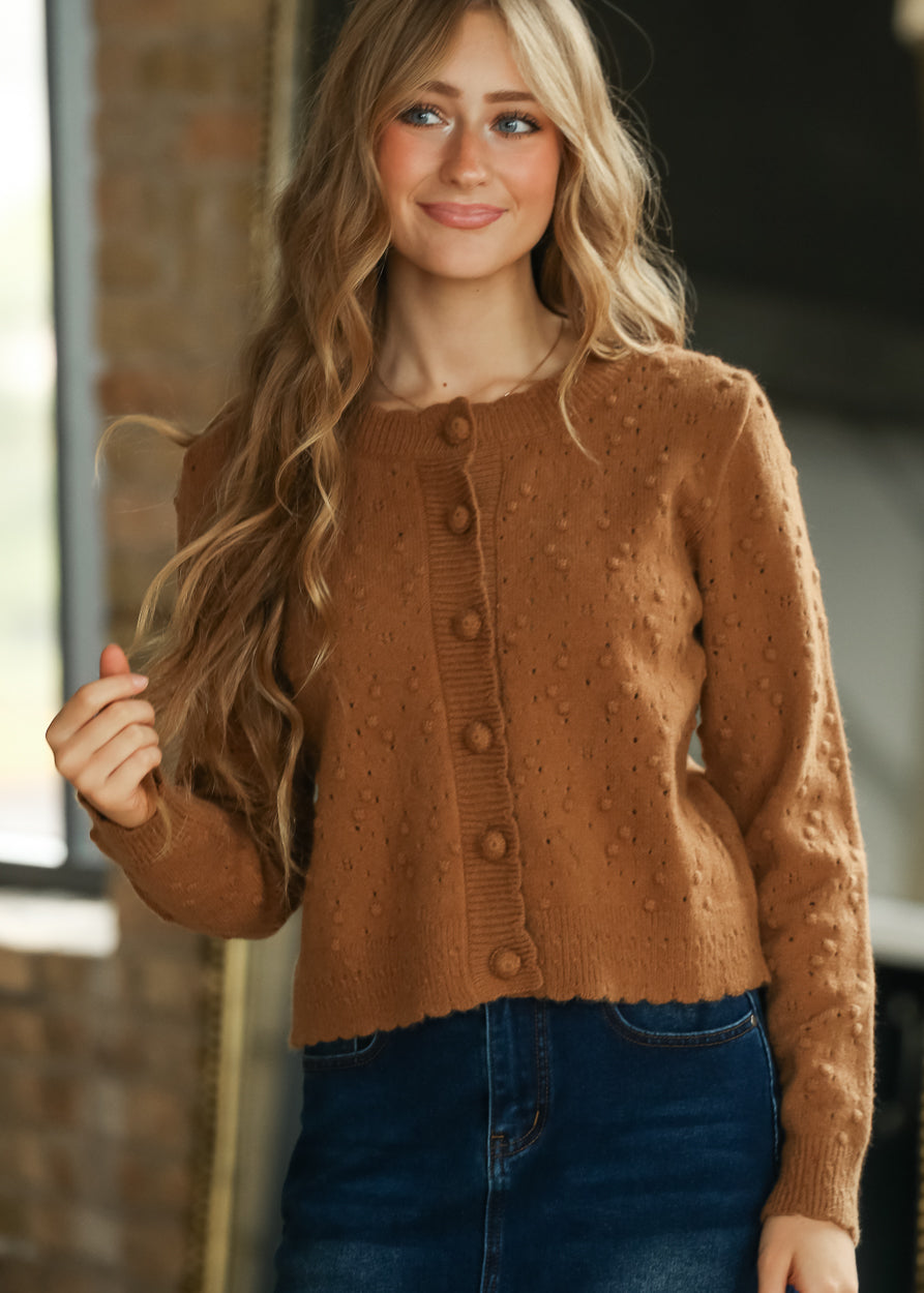 Camel bobble knit cardigan with functional tonal buttons, round neckline and scalloped hem.