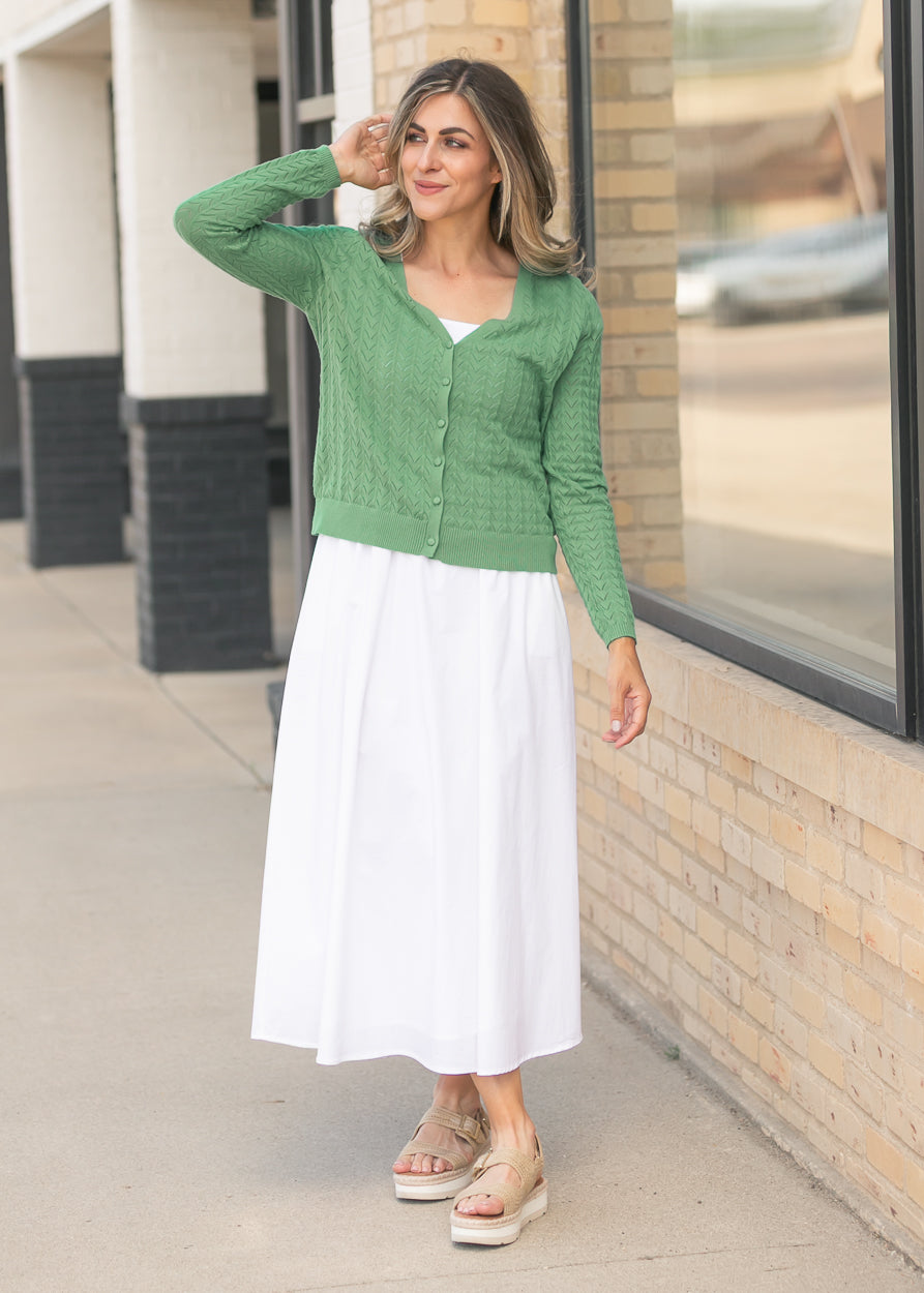 Lightweight green pointelle cardigan styled with platform sandals
