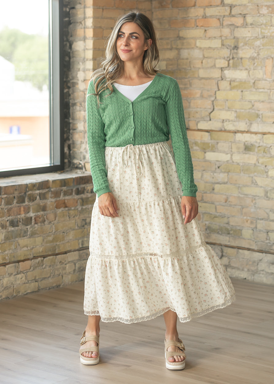Green cotton cardigan paired with a floral tiered maxi skirt
