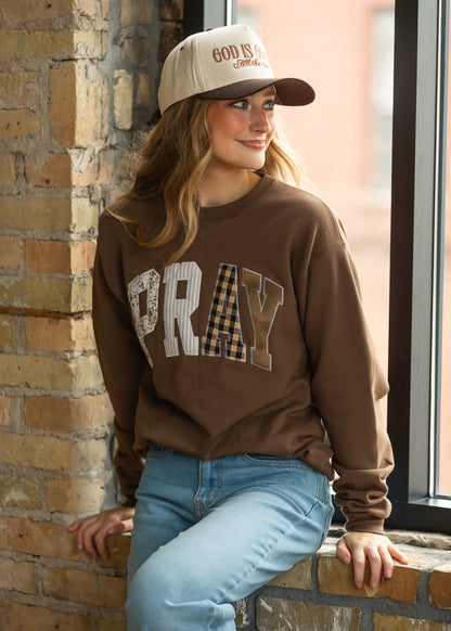 Brown Christian graphic sweatshirt with mixed floral, stripe, and gingham PRAY lettering