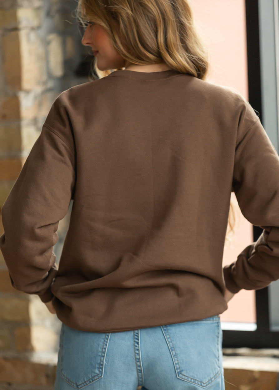 Back of brown Christian crewneck sweatshirt showing relaxed loose fit