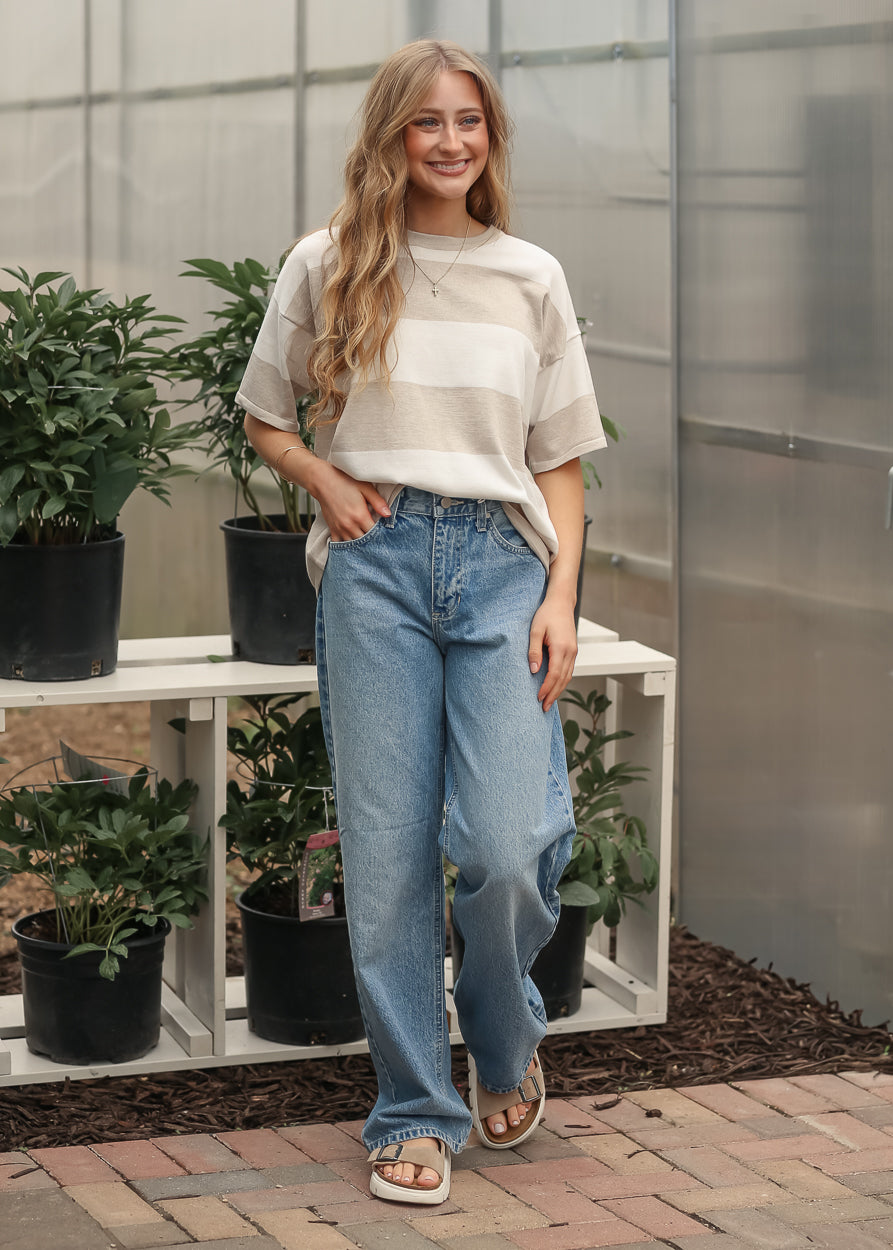 Oversized striped t-shirt paired with relaxed leg jeans